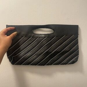 Black zipper purse, closes with a magnet